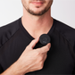 Man attaching compact wireless Bluetooth mic to black shirt collar for clear audio recording