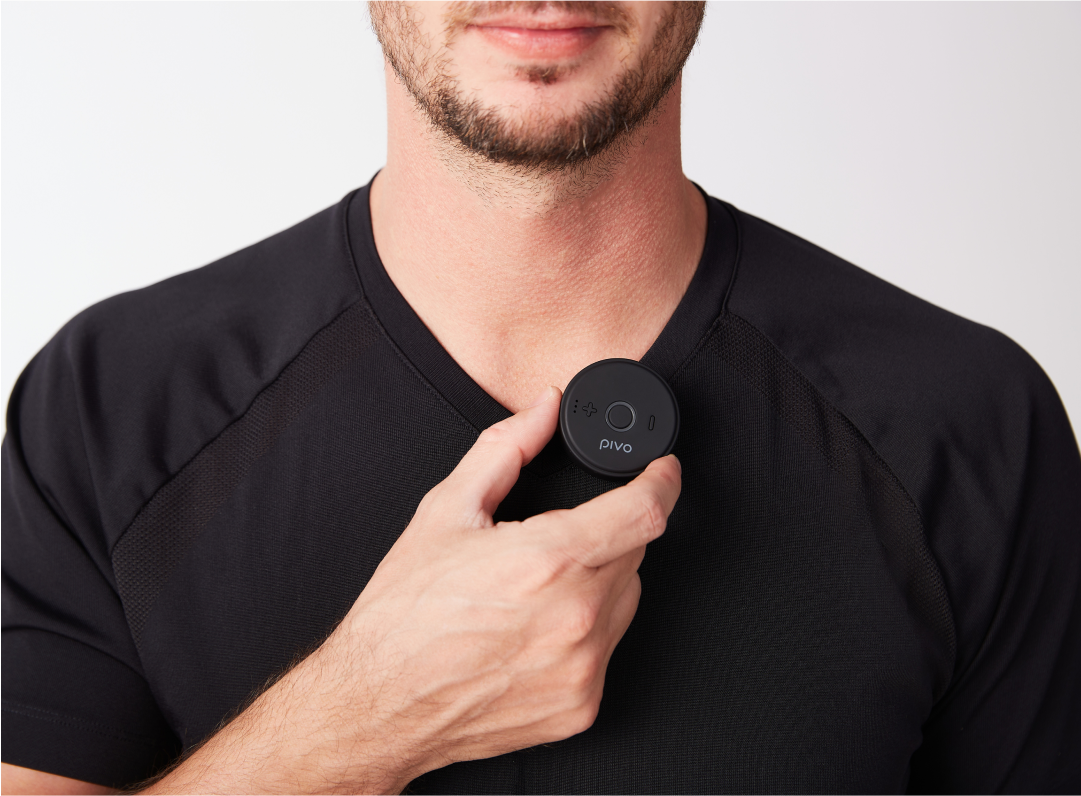 Man attaching compact wireless Bluetooth mic to black shirt collar for clear audio recording